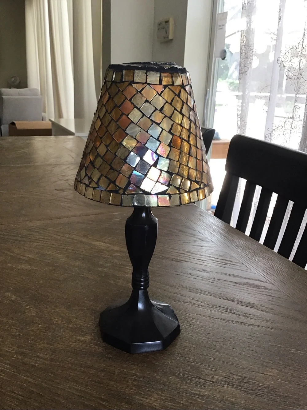 Mosaic tealight candle lamp featuring a stained glass shade.
